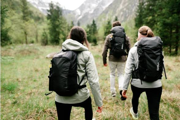 Shot of three hikers' hiking rucksacks in a sporty look from behind